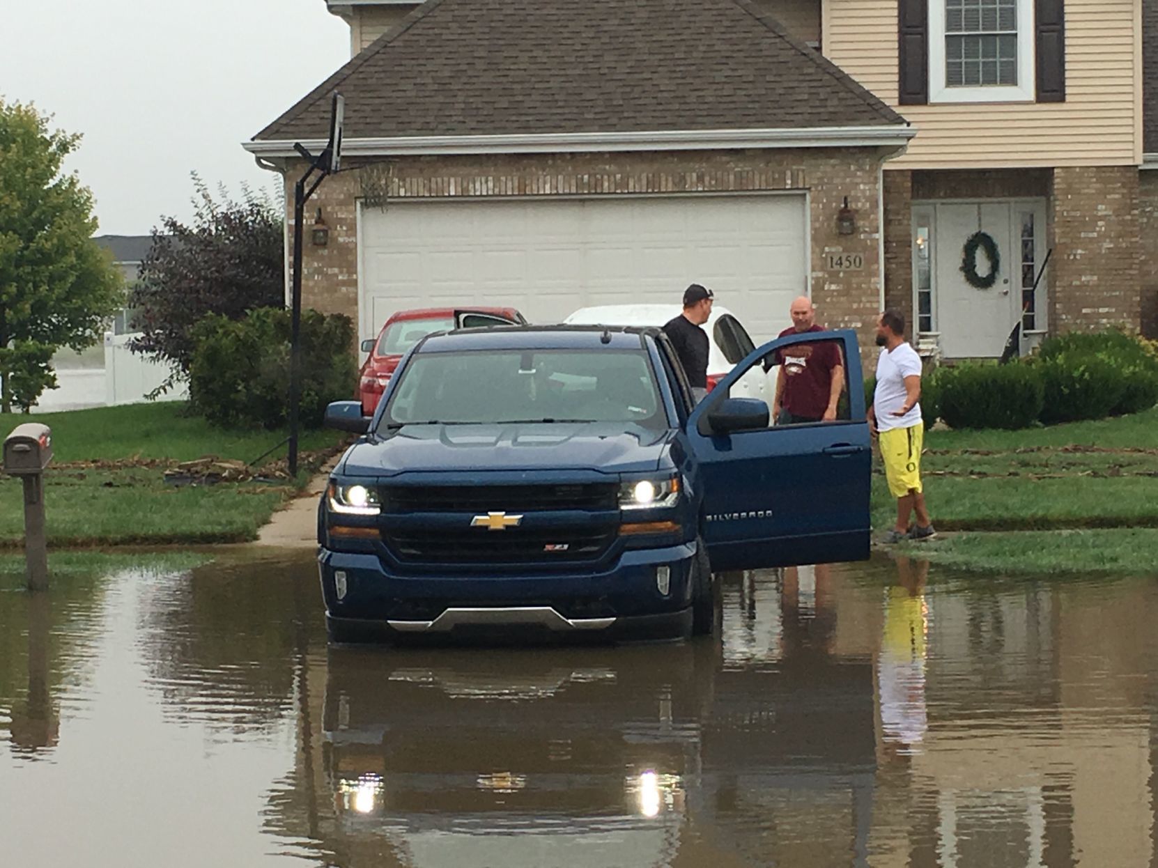 Heavy rains leave flooded roads, storm debris in their wake